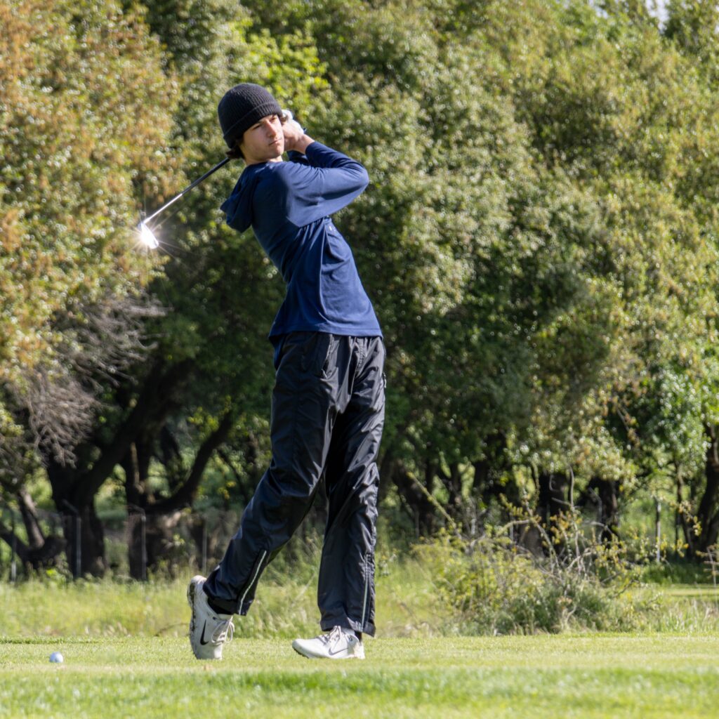 Golfer in backswing stance