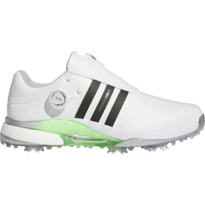 white with black stripes and green bottom golf shoes