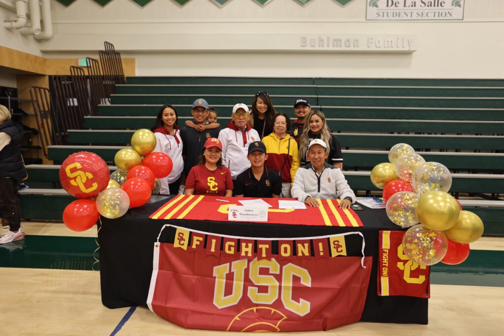 Jaden Dumdumaya with his family after signing to USC