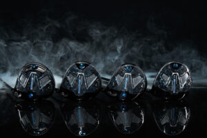 The 4 Callaway Paradym Ai Smoke Drivers lined up on a black background with smoke blowing behind them