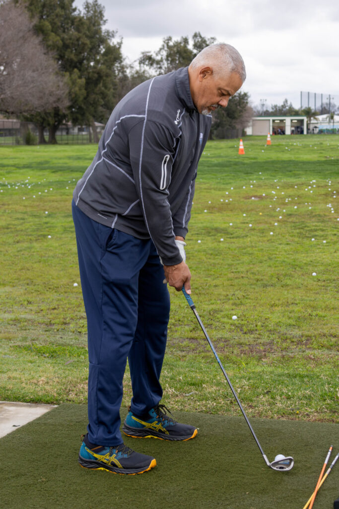 A veteran on the back of the course at Haggin Oaks driving range during his PGA Hope course