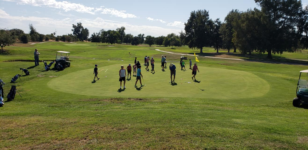 Junior Golfers around the green