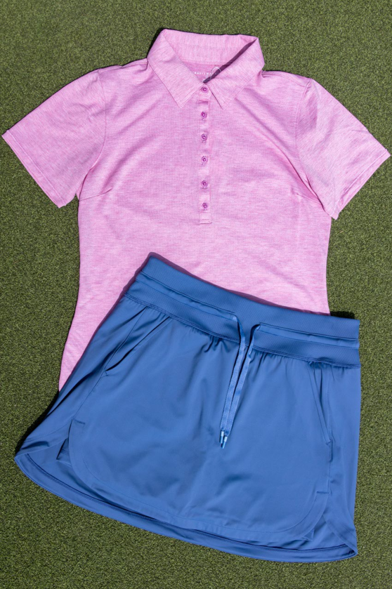 Pink Polo with blue skirt on grass background