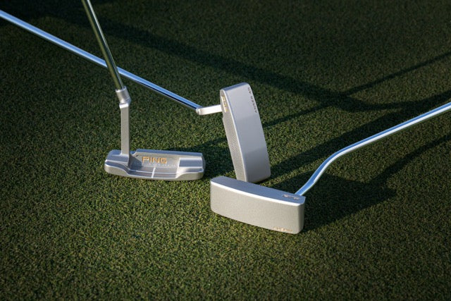 Silver Putters on grass