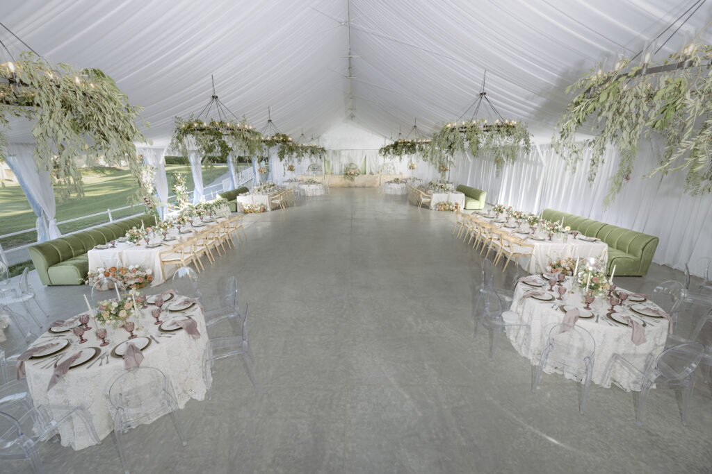 A raised, interior shot of the tent at Bartley Cavanaugh. The whole room can be seen, set up with tables and couches.
