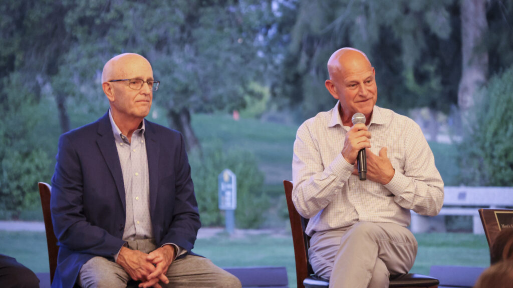 Vic and Gary Loustalot on stage after being inducted into the Hall of Fame.