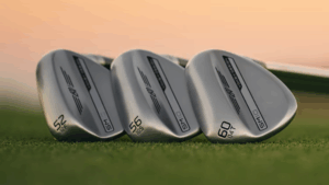 A close up of SM10 wedges lined up on grass