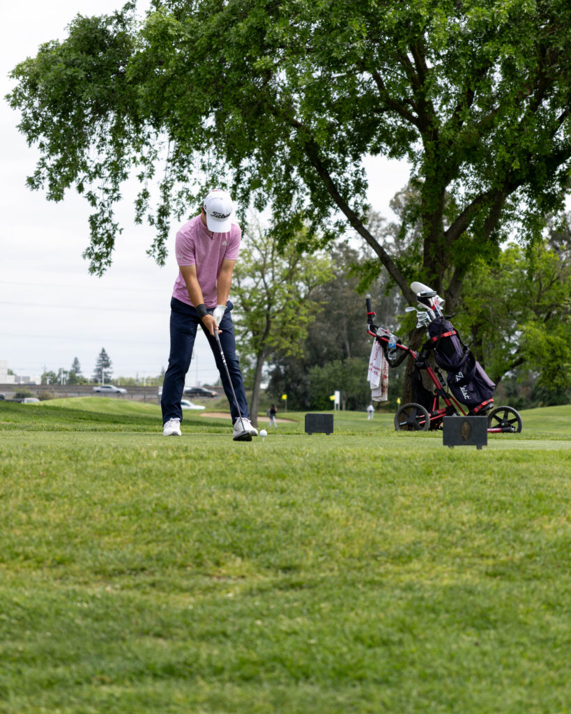 An AJGA Junior Golfer Teeing Off