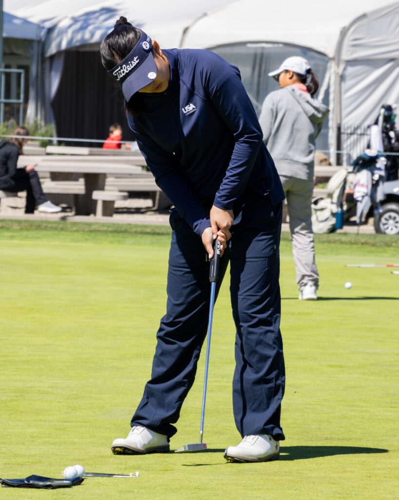 An AJGA Junior Golfer on the putting green