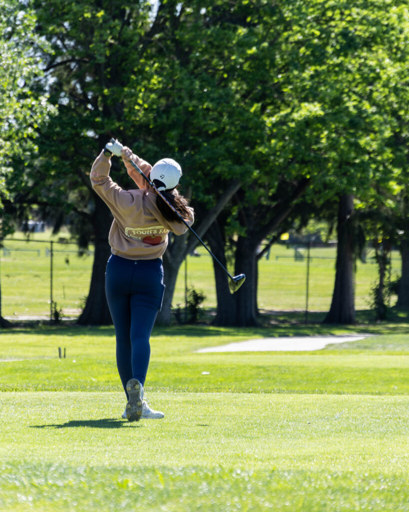 An AJGA Junior Golfer Teeing Off