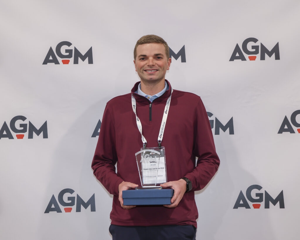 Sean Woods holding his AGM award