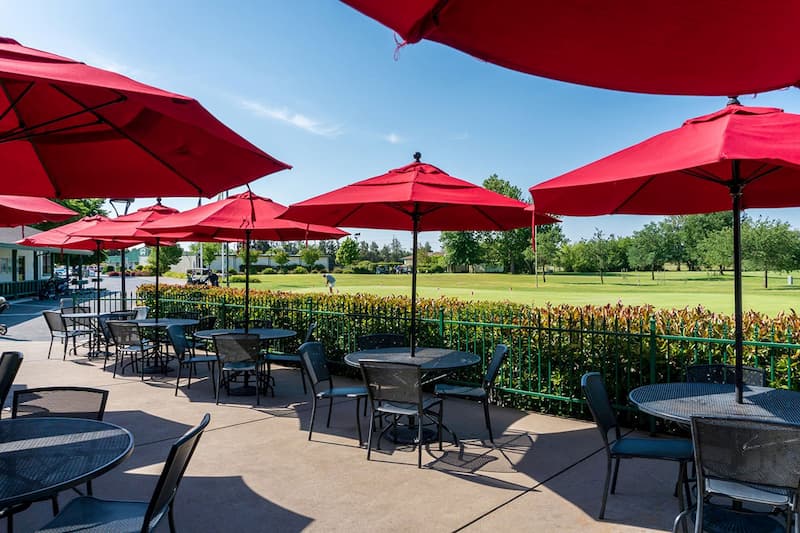 Outdoor patio dining at MacKenzie’s Sports Bar & Grille overlooking Haggin Oaks Golf Complex in Sacramento