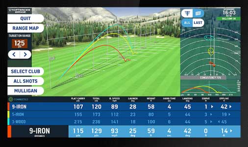 Toptracer Range at Haggin Oaks Golf Complex showing golfers practicing in covered driving range bays with ball tracking screens