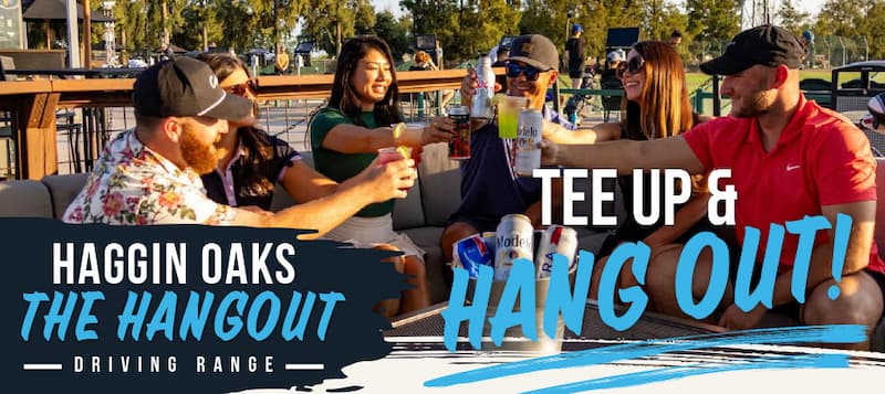 People raising drinks while relaxing on outdoor lounge seating at the Haggin Oaks Driving Range. The image promotes the social atmosphere with the text, "Haggin Oaks The Hangout Driving Range" and "Tee Up & Hang Out!"