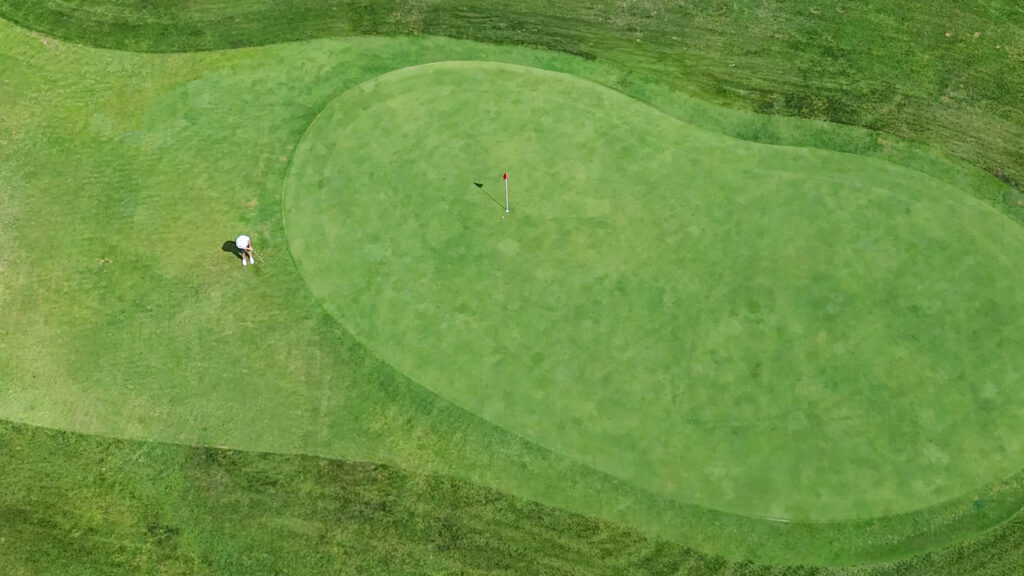 a golfer golfing at Arcade Creek Haggin oask aerial photo